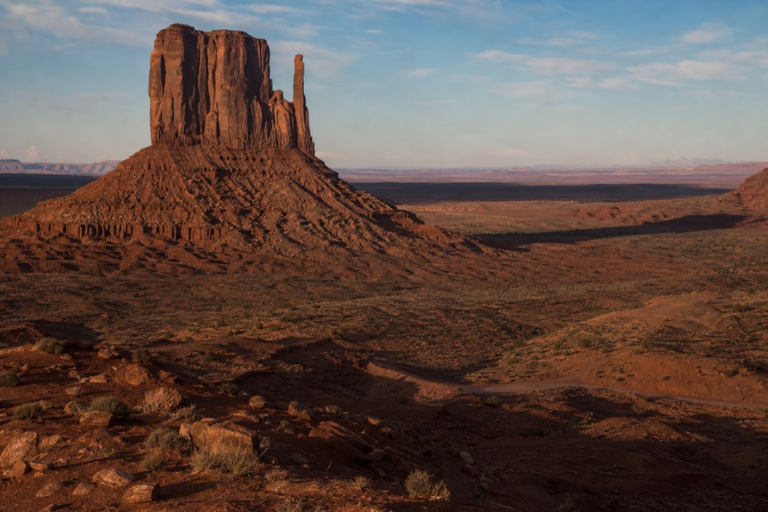 Late afternoon shadows stretching across the valley floor from West Mitten Butte